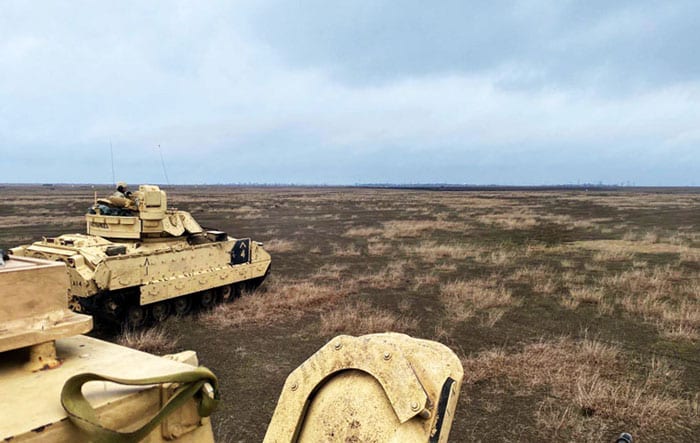 Bradley Tanks Mobilizing in a Romanian Field